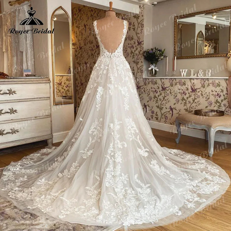 Robe de mariée sans manches à col en V, en dentelle. Robe dos nu Élégant