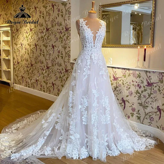 Robe de mariée sans manches à col en V, en dentelle. Robe dos nu Élégant